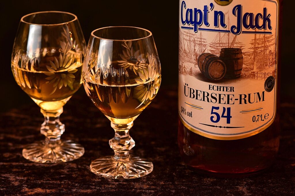 Aged rum bottle and tasting glass