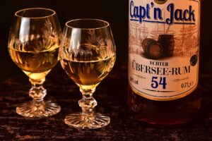 Aged rum bottle and tasting glass