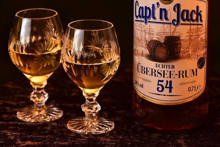 Aged rum bottle and tasting glass