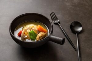 Hearty root vegetable soup served in a bowl